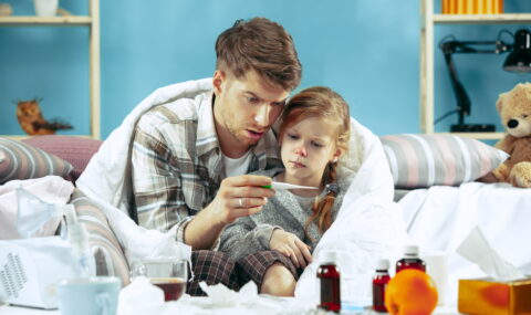 sick-man-with-daughter-home-home-treatment-fighting-with-desease-medical-healthcare-family-iilness-winter-influenza-health-pain-parenthood-relationship-concept-relaxation-home